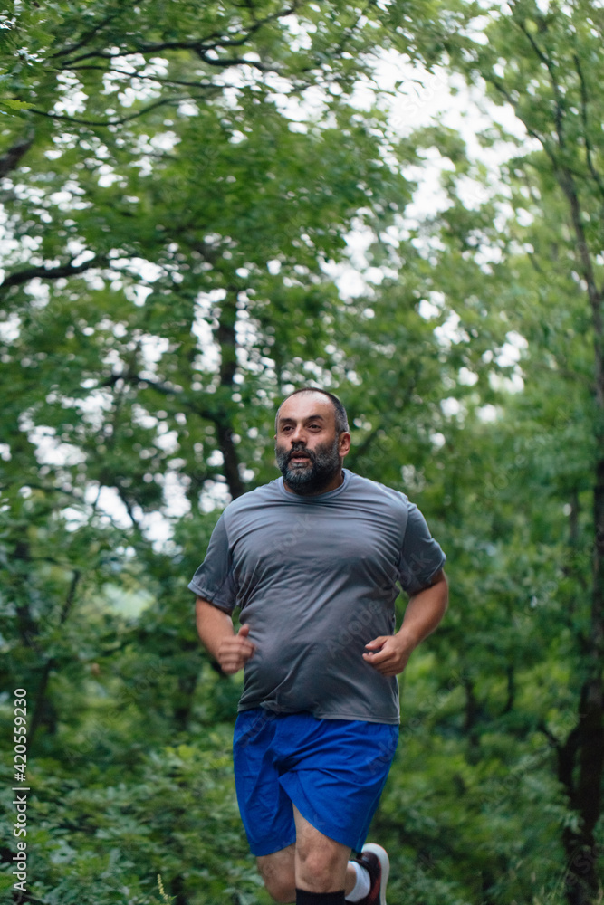 Man Jogging Through A Forest Man Jogging Through A Forest