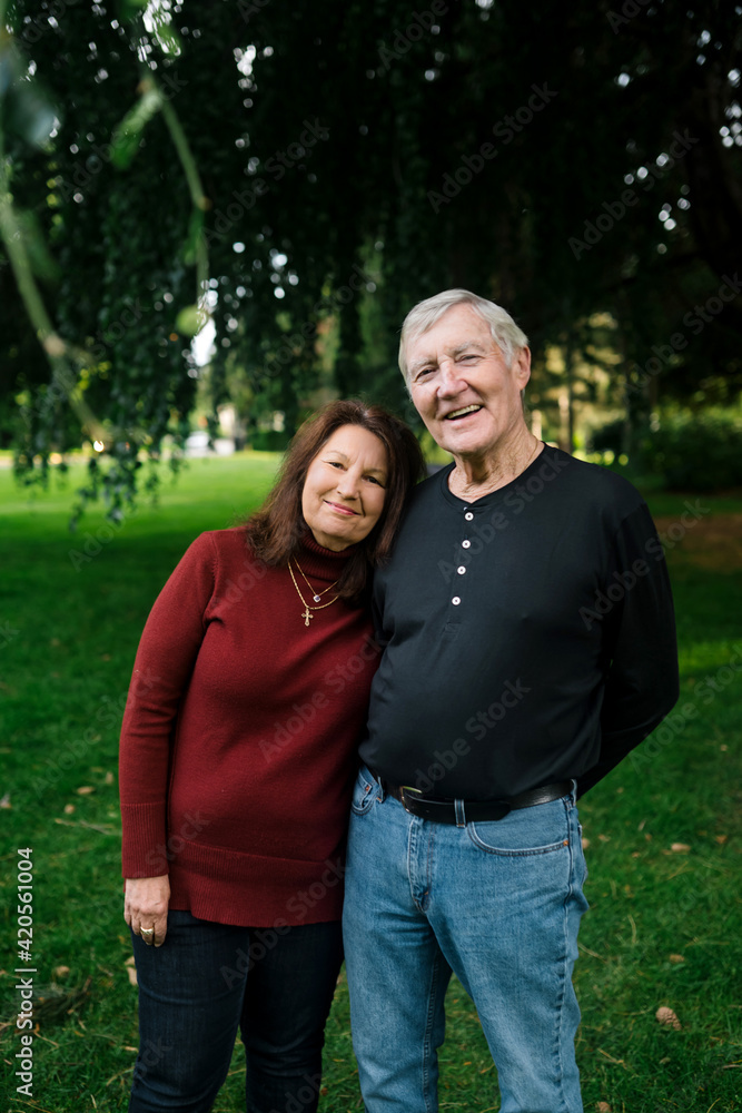 Smiling older couple spending time together in a park.
