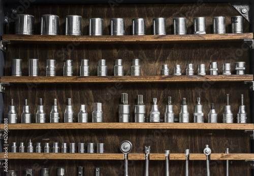 Neatly sorted hand tools in a workshop. 