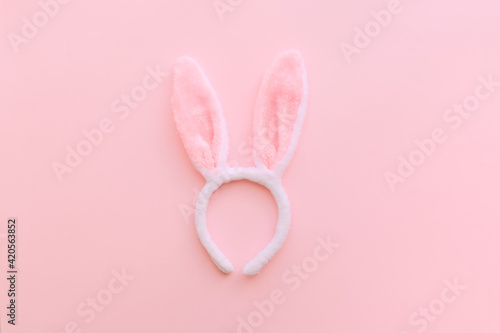 Bunny ears and eggs on pink backround on Easter day. Celebrating Easter at spring.