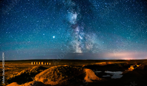 summer milky way over grain storage bin