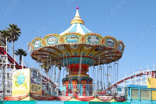Colorful carousel at amusement park photo