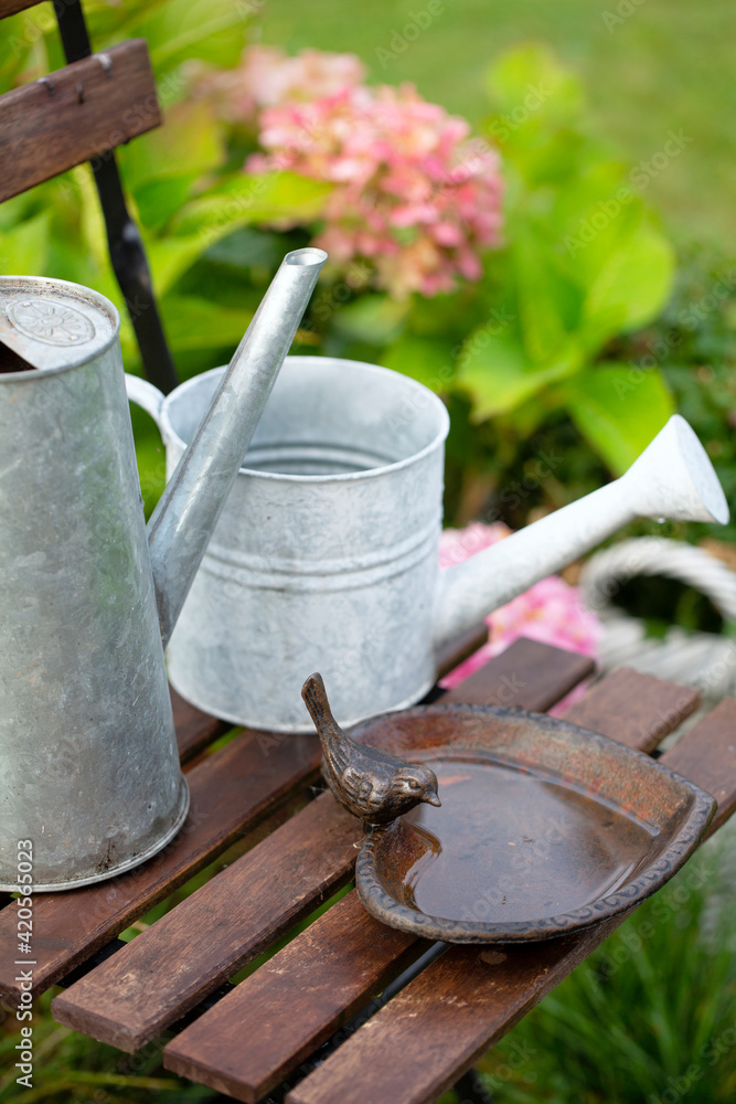 Nostalgic Bird Bath And Can Still Life Stock Photo | Adobe Stock