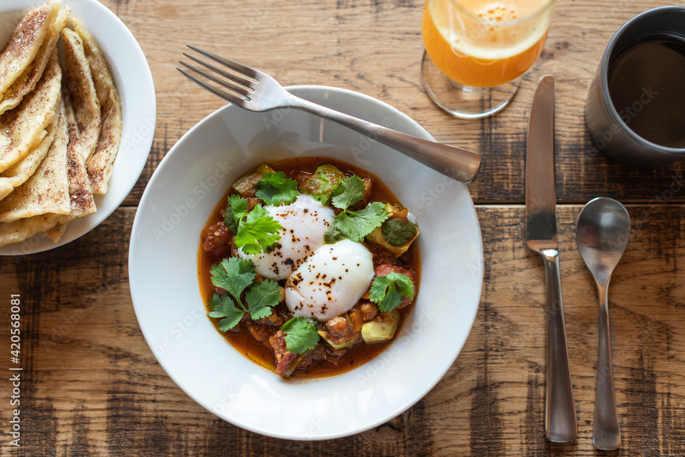 Mexican style healthy breakfast on wooden table.