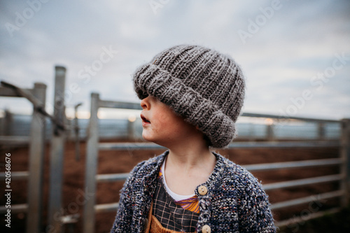 boy looking left with beanie on