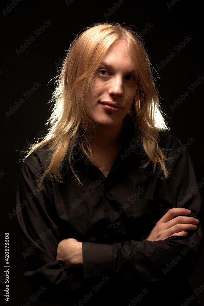 Young man with long blond hair