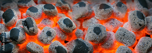 Картината върху платно Glowing ember fire hot coals during barbecue background.