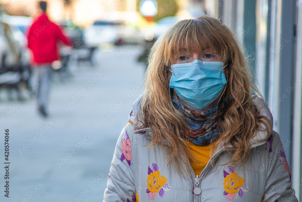 woman with mask on the street in the new normal woman with mask on the street in the new normal