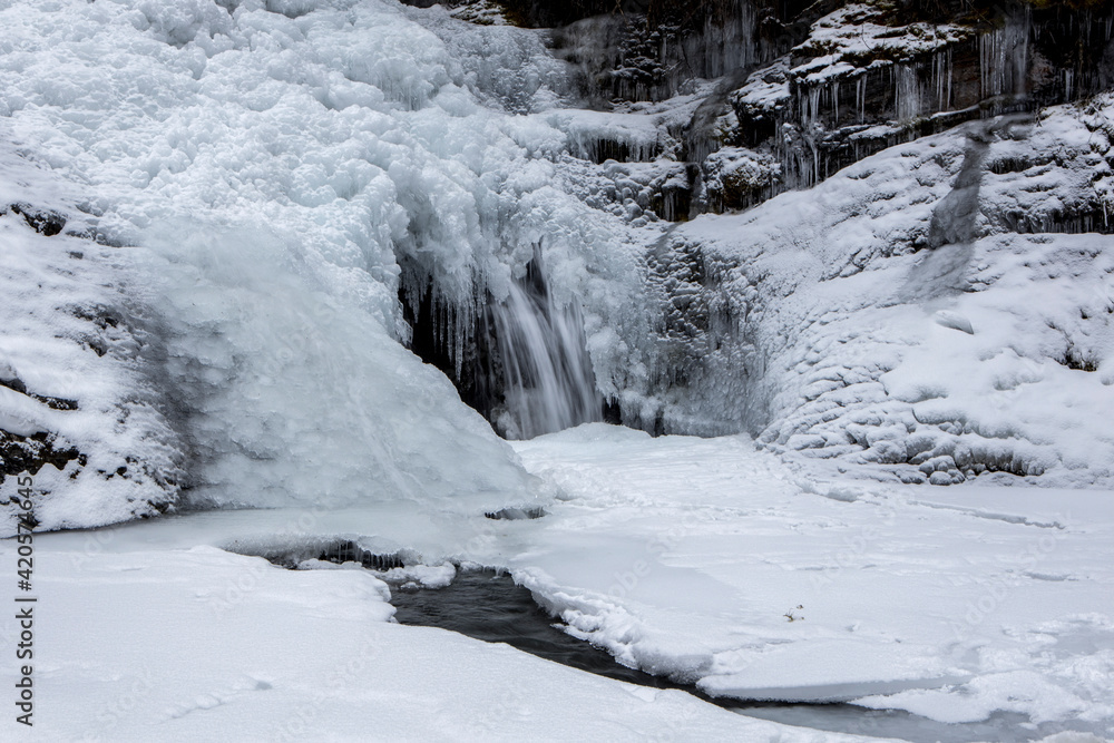 Frozen Sweetcreek Falls in winter.
