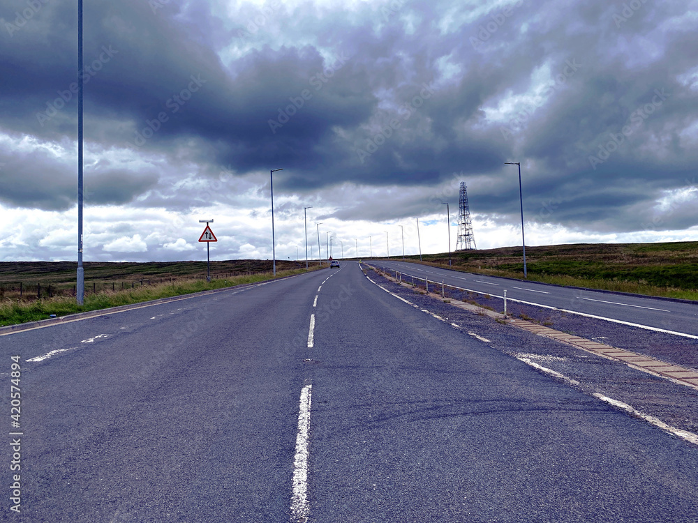 Evening, on the Ripponden Road, with heavy clouds over the moors near, Sowerby Bridge, Halifax, UK
