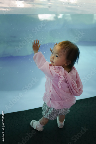 Close up of dad with daughter in aquarium photo