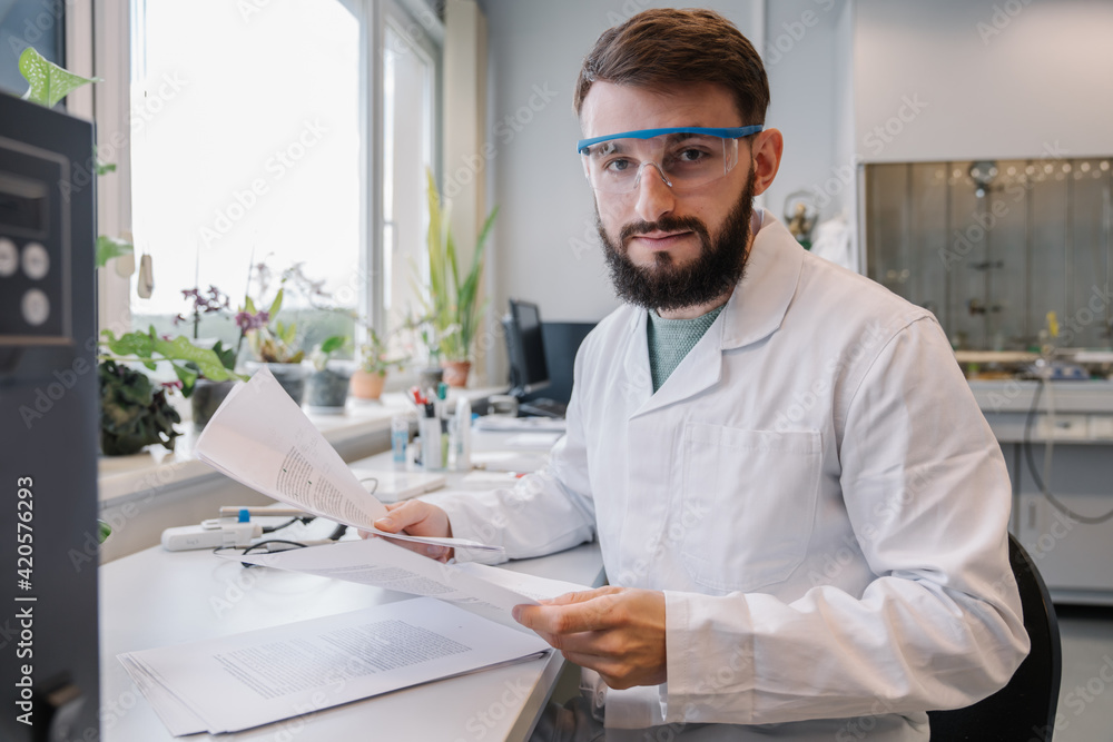 Portrait Of A Scientist Holding Documents