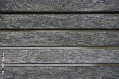 wooden planks of a bench