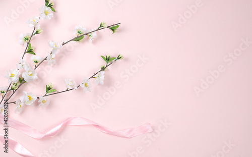 Abstract spring card  delicate pink background with blossoming branch with place for text  holiday concept with flowers  banner for screen  greeting card for mother s day  happy birthday  wedding 