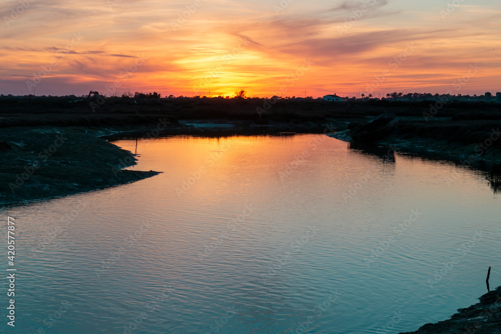Beautiful landscape. Stunning sunset in the marshes of Chiclana de la Frontera, Cádiz, Andalusia, Spain.