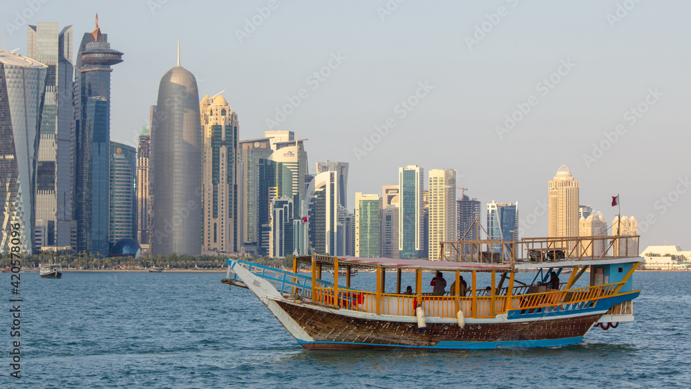 Fototapeta premium Doha,qatar- 15 January 2020 : People enjoying a boat ride in Doha corniche.