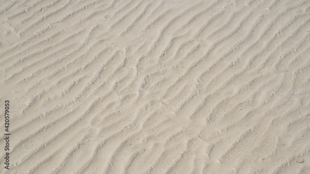 Natural sand pattern on flat sandy beach during low tide. Natural sand pattern on flat sandy beach during low tide.