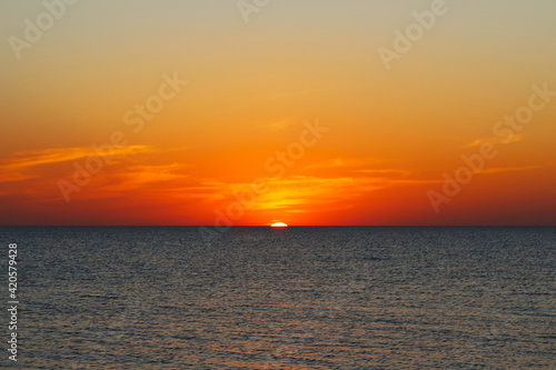 Fototapeta Naklejka Na Ścianę i Meble -  Beautiful sunset at the sea. Horizon. Selective focus. Background. Scenery. Texture.