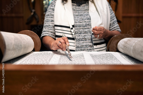 Synagogue: Woman Congregant Reading From The Torah photo