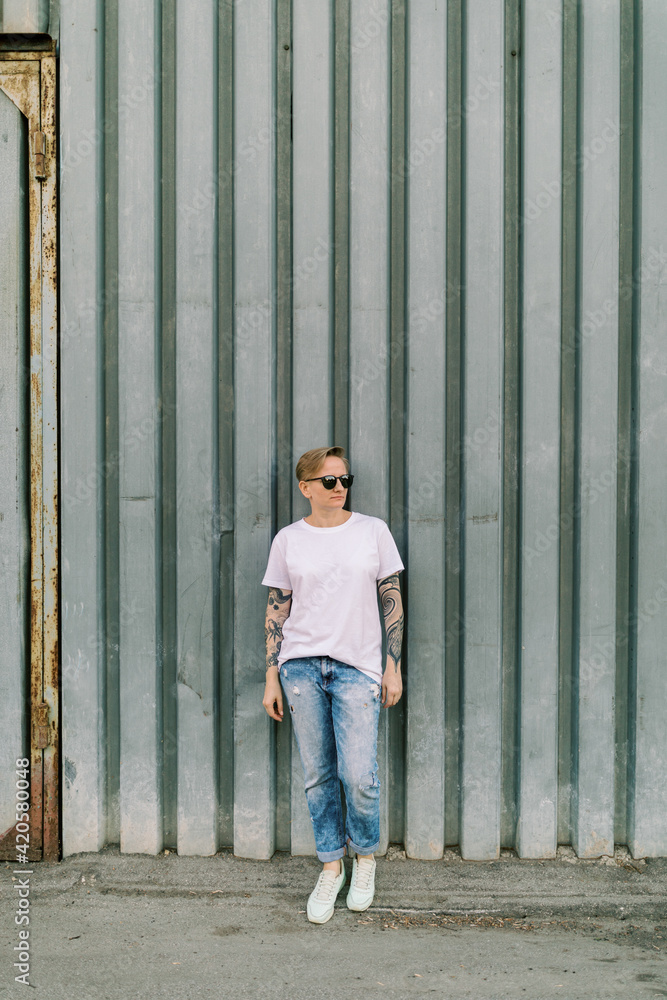 Androgyne woman with short hair outdoors Androgyne woman with short hair outdoors