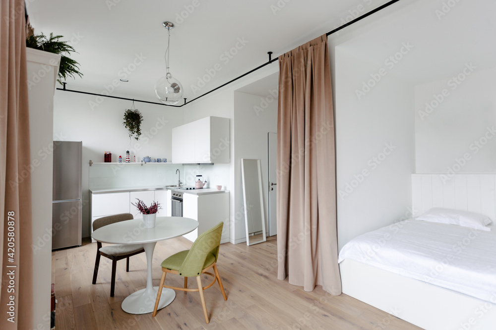 Living room, kitchen and bedroom of a small modern flat Stock Photo ...