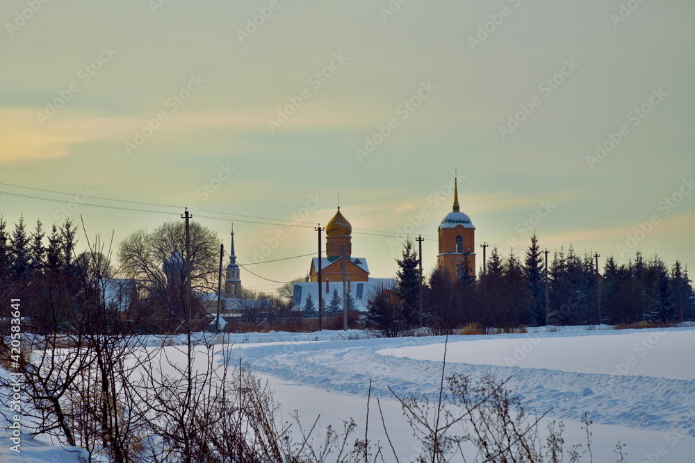 St. Kazan convent on the background of a snow-covered field
