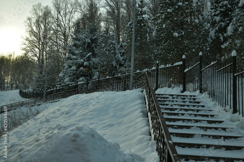 snow-covered steps of the stairs at the font in the forest © Игорь Воробьёв