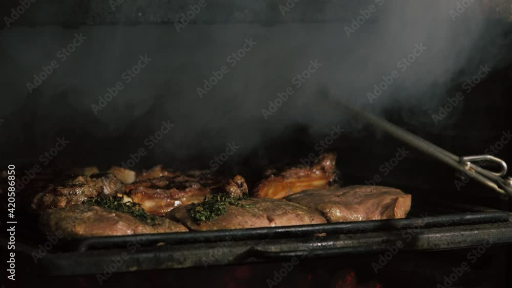 Delicious fatty organic marinated meat on the bone of beef lamb, pork. High quality 4k footage Delicious fatty organic marinated meat on the bone of beef lamb, pork. High quality 4k footage