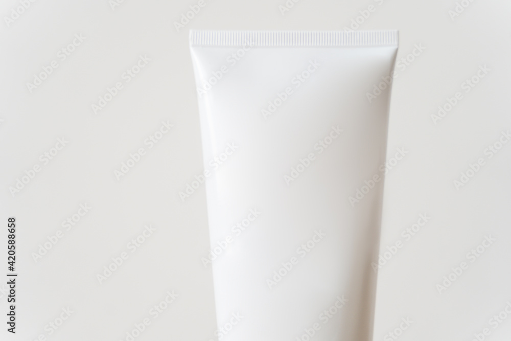White tube cream mockup on a wooden table. White tube cream mockup on a wooden table.