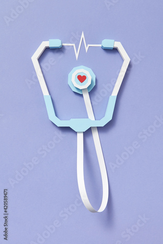 Handmade papercraft stethoscope with heartbeat.