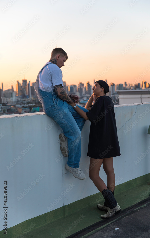 Couple spending time together on a rooftop Couple spending time together on a rooftop