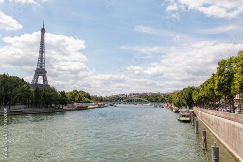 Seine River and the Eiffel Tower under a beautiful blue sky