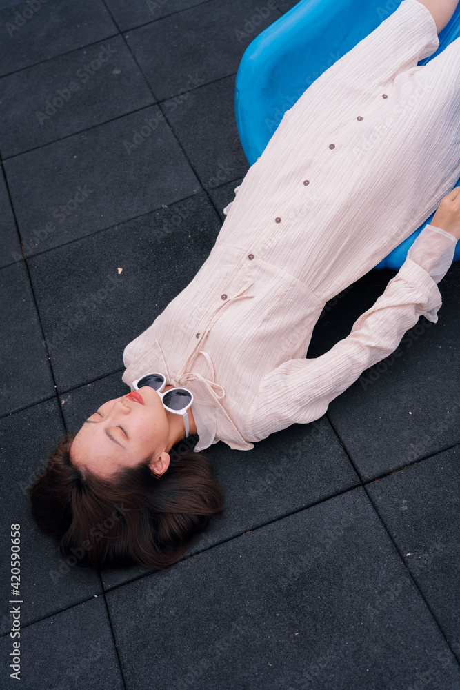 © Pansfun Images/Stocksy - funny portrait of Asian fashionable young woman © Pansfun Images/Stocksy - funny portrait of Asian fashionable young woman