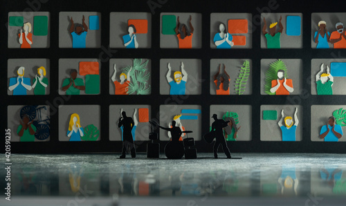 Music band's silhouette in front of mega screen