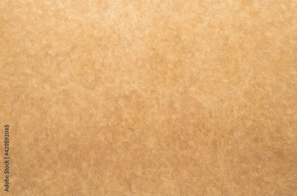 Fototapeta premium Vintage aged worn brown paper texture background with copy space