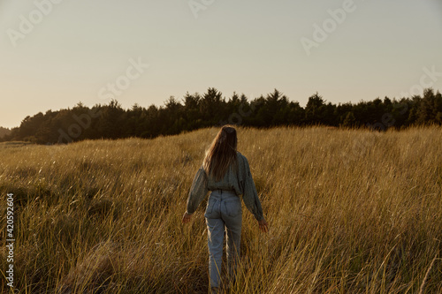 Woman Walking in Field photo