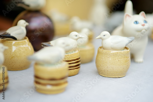 Ceramic dishes, tableware and jugs sold on Easter market in Vilnius © MNStudio