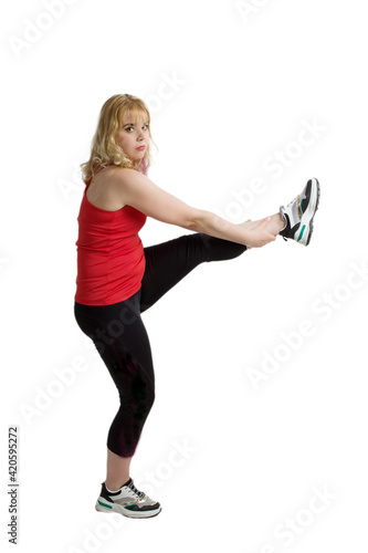 A blonde woman with overweight, engaged in sports or fitness.