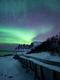 Surreal aurora sky at the arctic coast of Norway