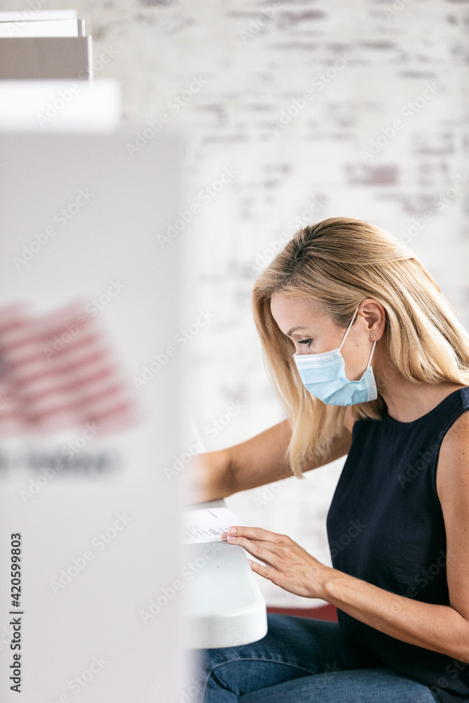 Woman With Face Mask Votes During Pandemic Woman With Face Mask Votes During Pandemic