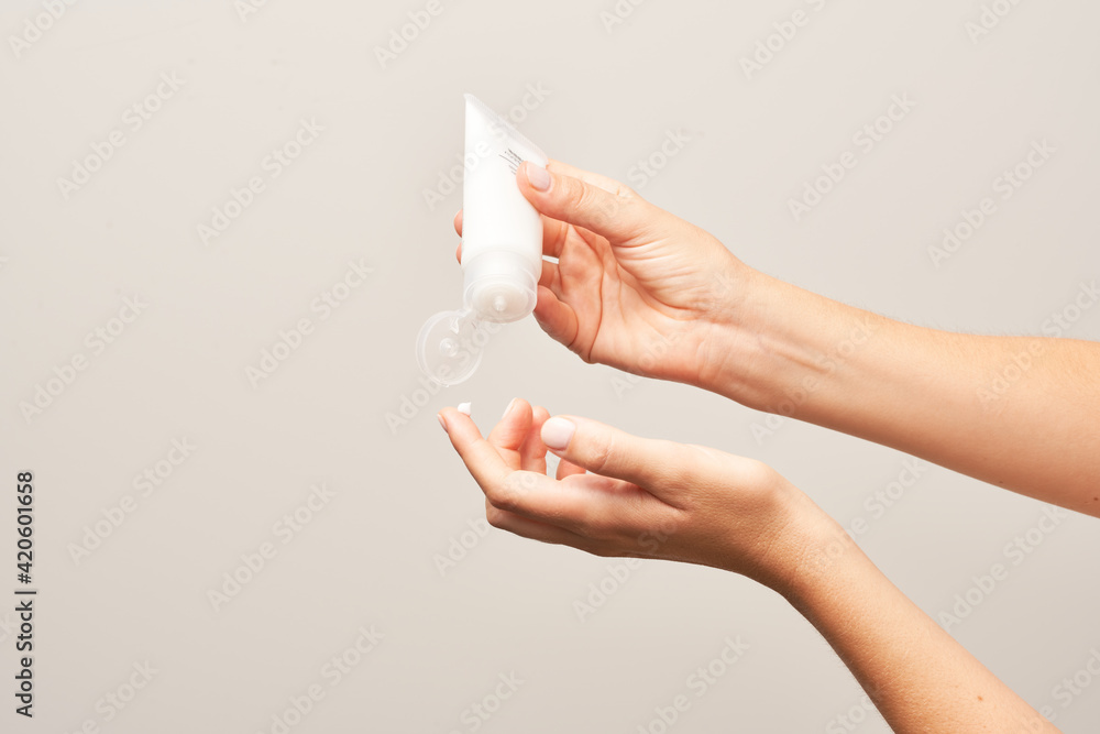 Crop woman using cream during spa procedure Crop woman using cream during spa procedure