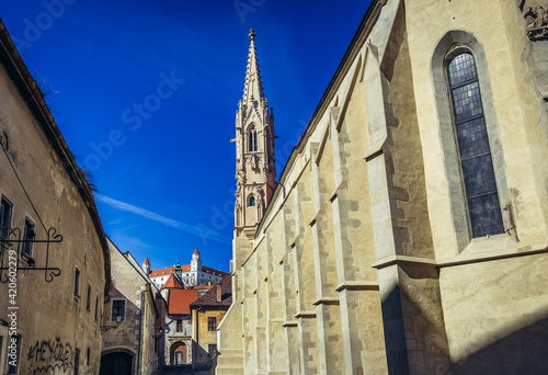 Photography Clarissine Church in historic part of Bratislava city, Slovakia, castle on backg