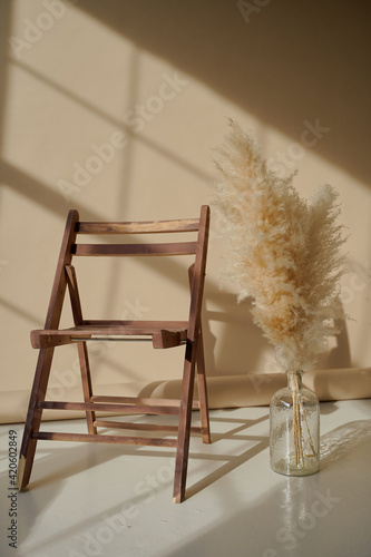 beautiful chair and vase in the Studio in beige photo