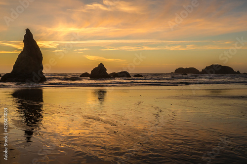 USA, Oregon, Bandon Beach. Wizard's Hat and other formations at sunset.