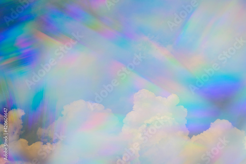 Prism against Fluffy Clouds in Sky photo