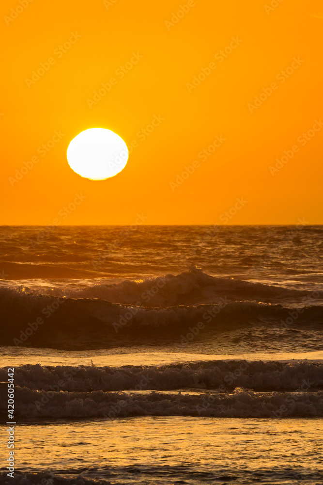 USA, Oregon, Bandon Beach. Sunset on beach surf.