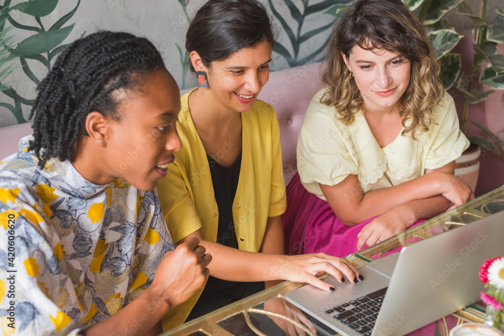 Businesswomen Working Together And Using A Laptop Businesswomen Working Together And Using A Laptop