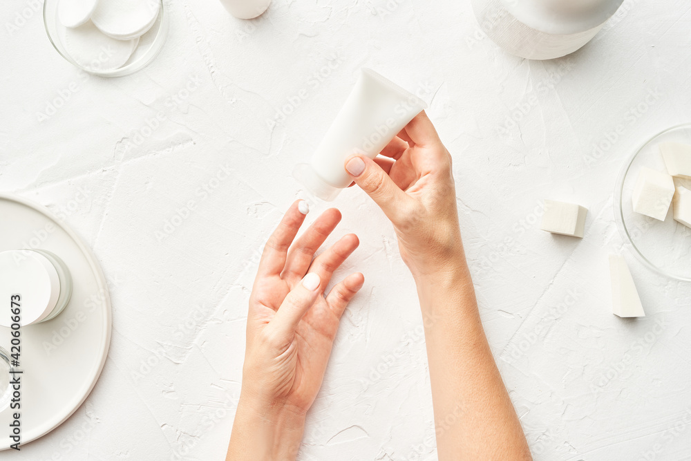 © 365mm/Stocksy - Crop woman applying cream on hands © 365mm/Stocksy - Crop woman applying cream on hands