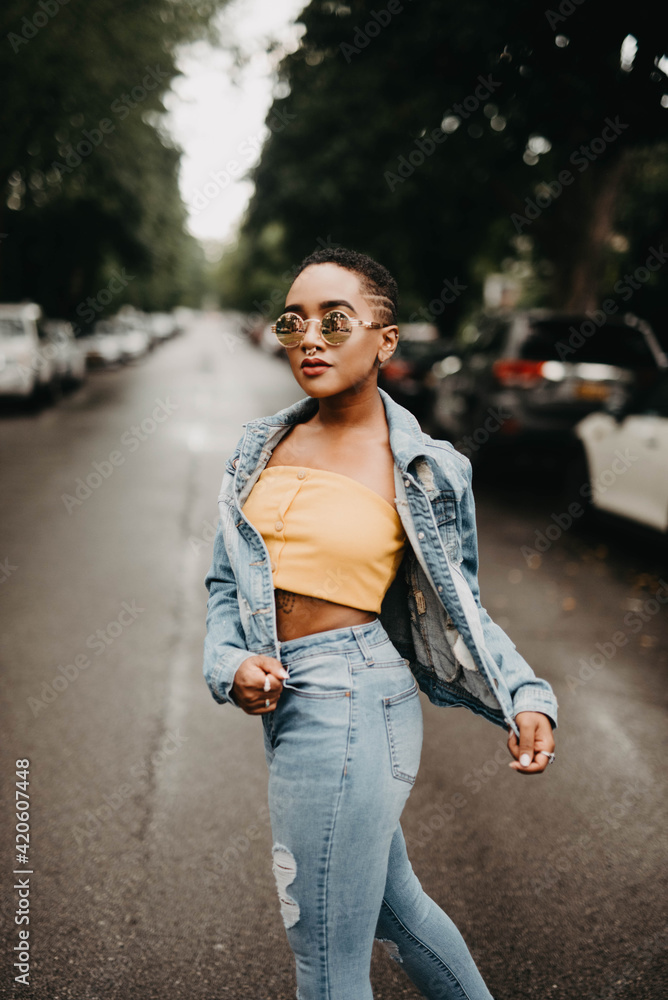 A young woman standing on the street A young woman standing on the street