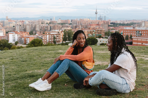 Girls chatting in the park in the daytime. photo